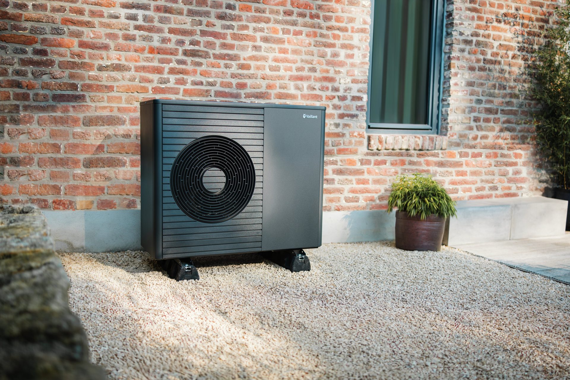 Vaillant air source heat pump installed outside a brick property